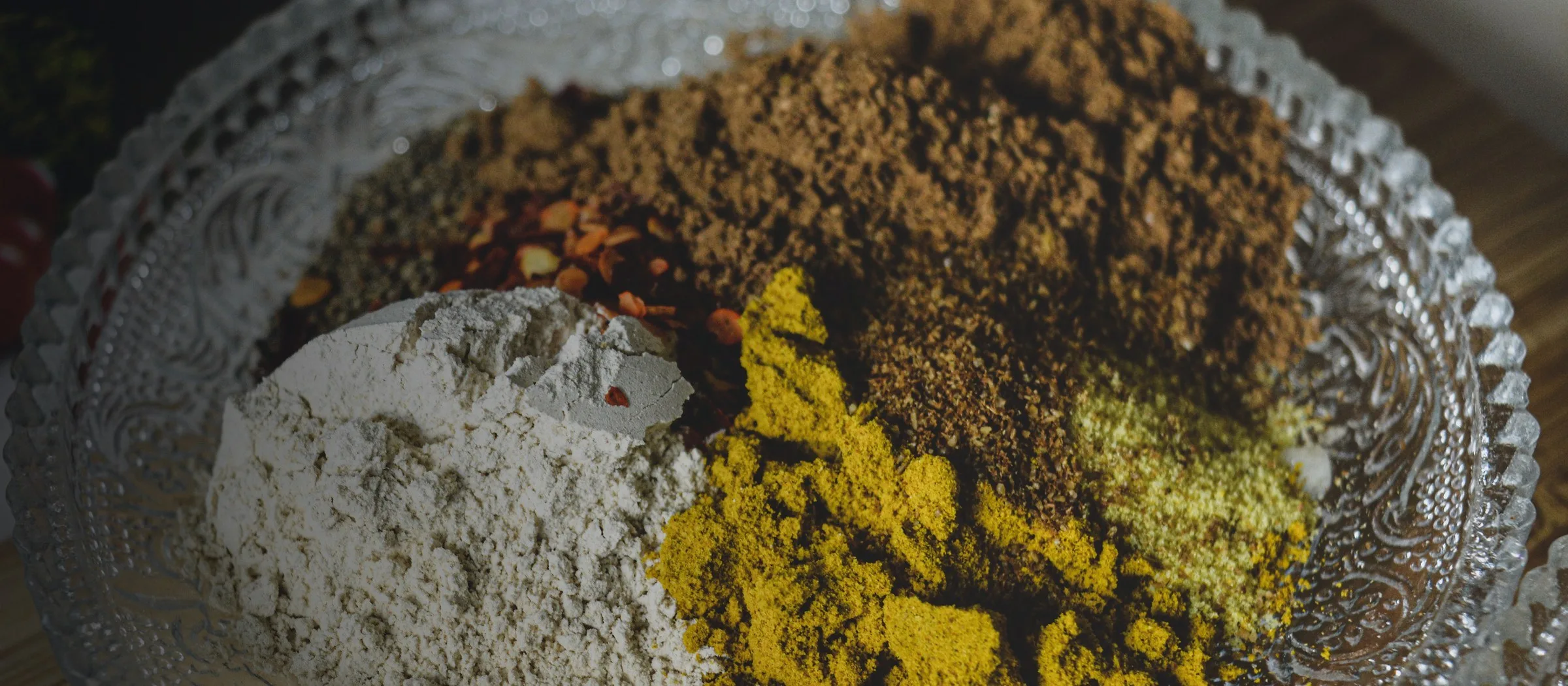 Indian spice powders arranged in a decorative metal plate